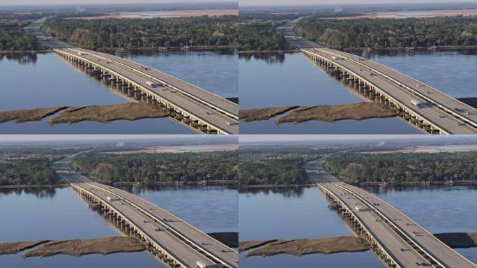 早春，佐治亚州不伦瑞克附近的95号州际公路上的一座桥上出现了轻微的早晨交通。具有平移相机运动的空中镜