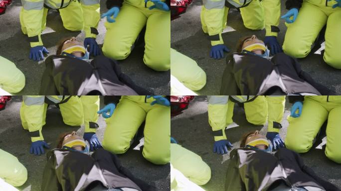 事故发生后，一名成年女子在救护人员的帮助下拍摄的慢镜头视频