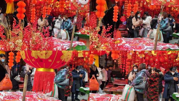 成都春节前街头购买红灯笼对联吉祥物的游客
