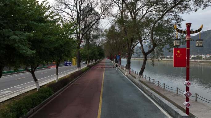 清晨在笔直的跑道上跑步的人