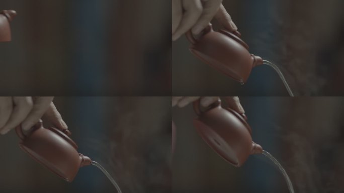 紫砂壶倒出冒着热气的茶水