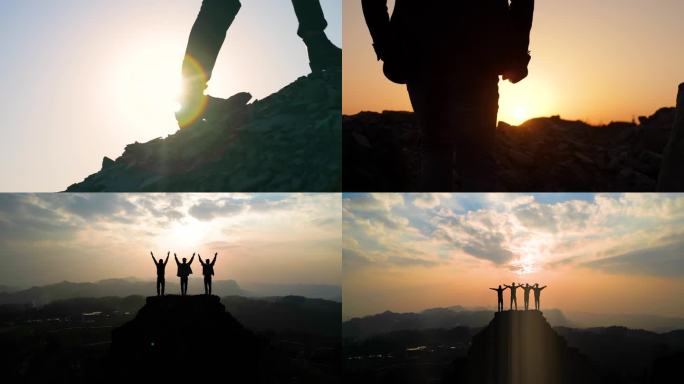 登山团队企业家勇攀高峰张双臂拥抱蓝天太阳