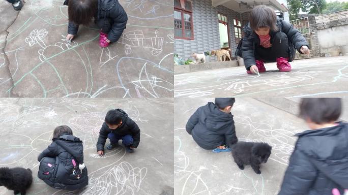 农村小孩子在庭院粉笔涂鸦画画