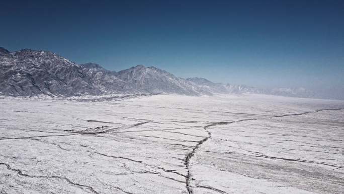 冬季西部山脉戈壁雪地大地航拍