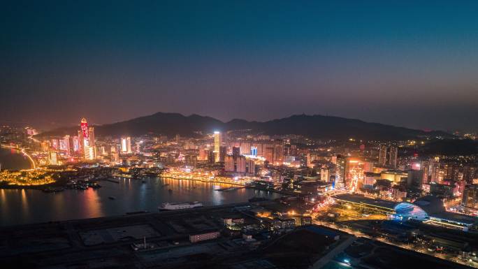 山东烟台城市夜景航拍海边繁华高楼