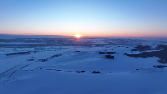 航拍呼伦贝尔雪域雪原日落