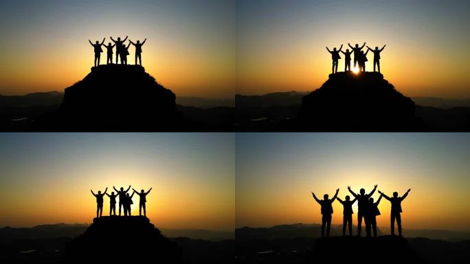 一群人登上山顶站在山顶张开双臂拥抱太阳光