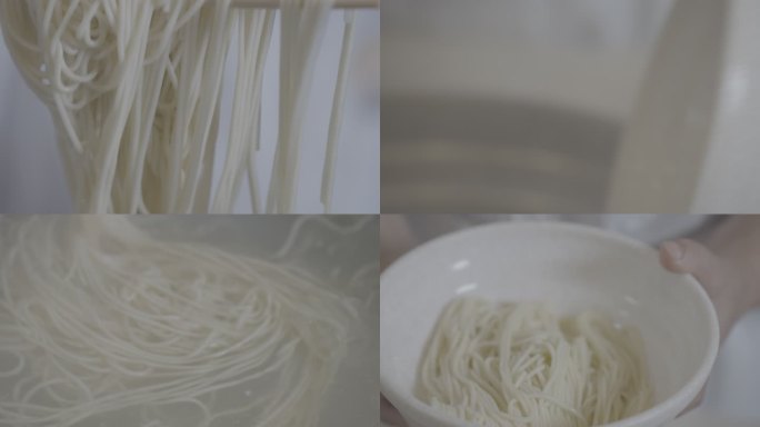 面条被筷子捞起放进碗里生活