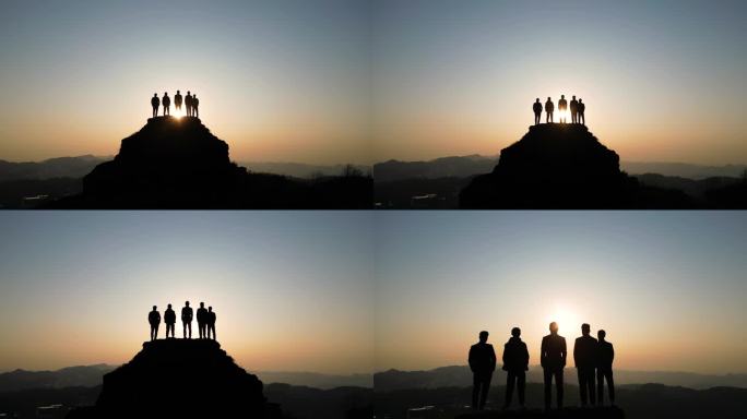 团队登山登山成功站在山顶眺望远方庆祝胜利