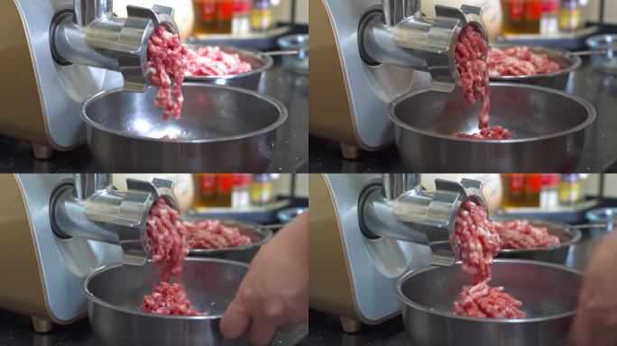 一台正在运行的商业绞肉机器在搅拌肉馅