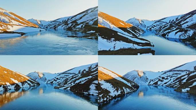 大海草山夕阳下结冰的湖面积雪的草山航拍