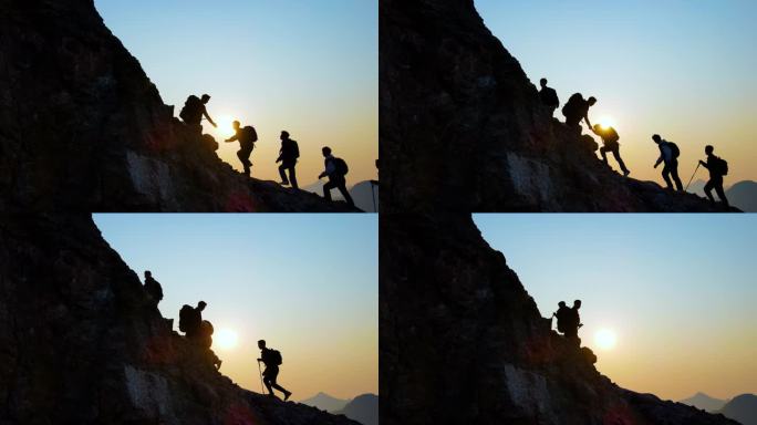 团队手拉手登山团队协作精神登山剪影攀登者