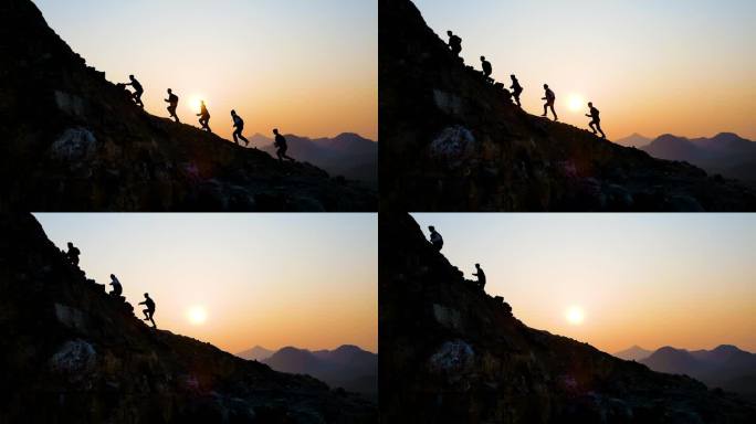 团队登山奔跑剪影攀登顶峰一群人冲向山顶
