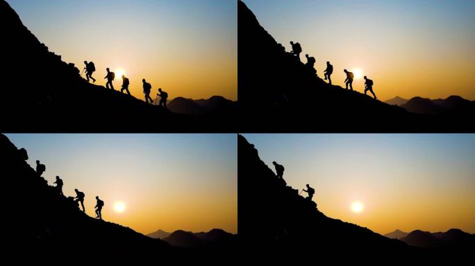 背包客逆光登山团队精神爬山剪影攀登顶峰