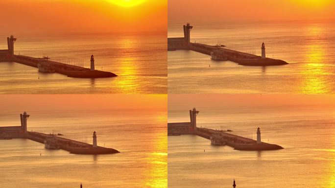 山东青岛海上日出日落阳光下的情人坝灯塔
