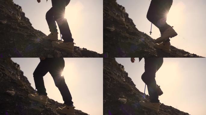 登山脚步逆光行走特写皮鞋登山爬山