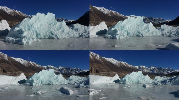 航拍一个人走在来古冰川的冰面上
