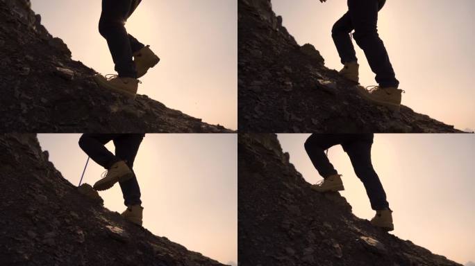 登山脚步逆光特写皮鞋登山爬山