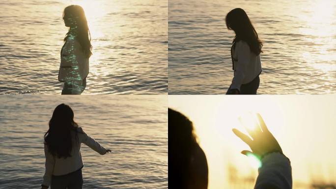 美女在日落的海边漫步触摸阳光