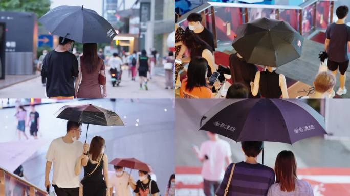 情人节下雨天撑伞约会的情侣