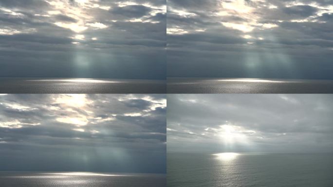 阳光透过云层打在海面上