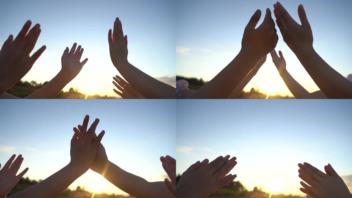 唯美夕阳逆光击掌游戏首部特写阳光穿过手指