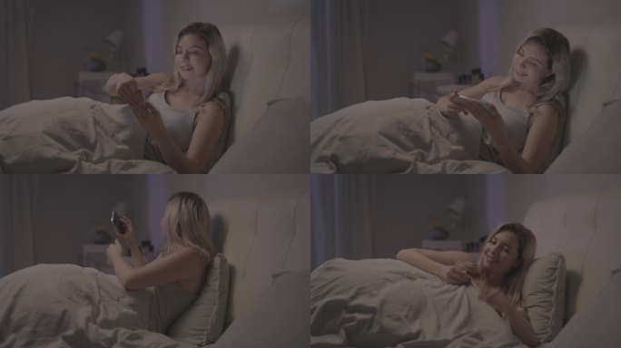 美女在床上看手机