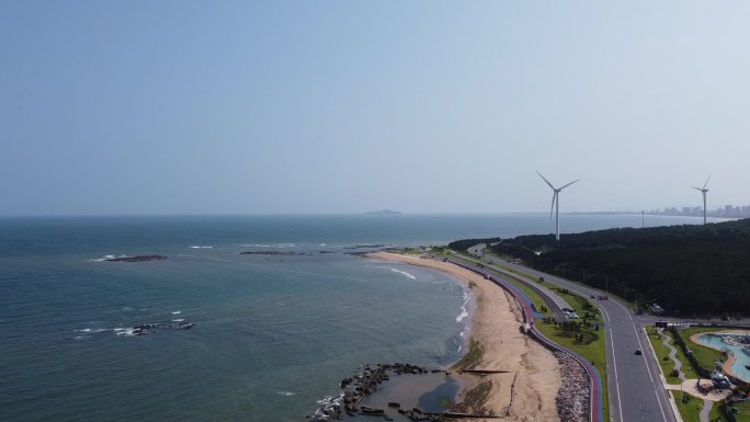 航拍山东威海海岸线公路风车唯美风光