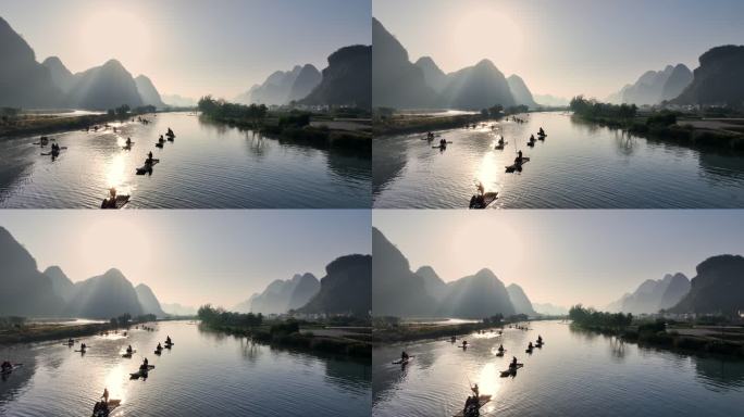 清晨日出时分阳朔遇龙河上漂流的竹筏