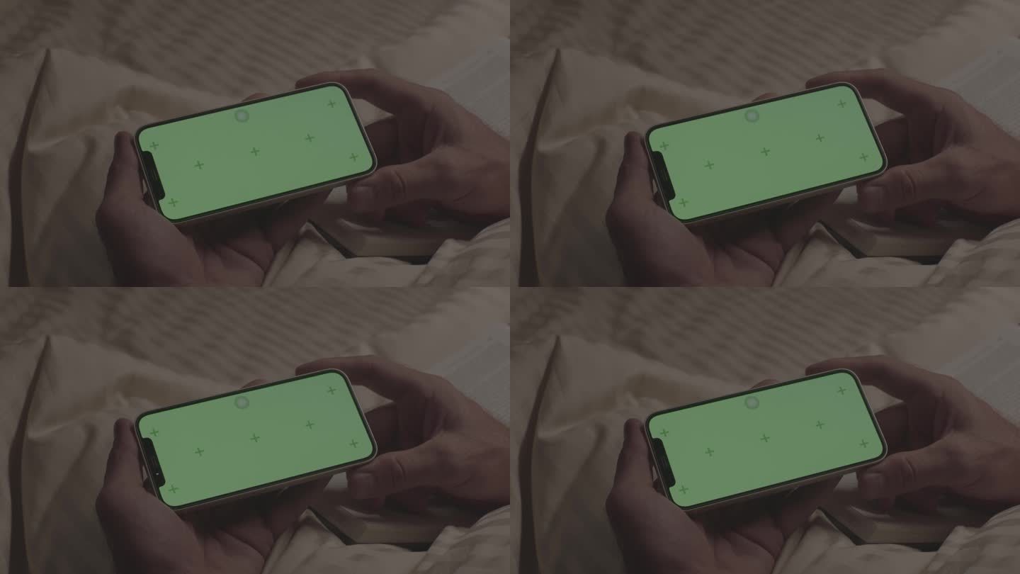 坐在床上看绿屏手机