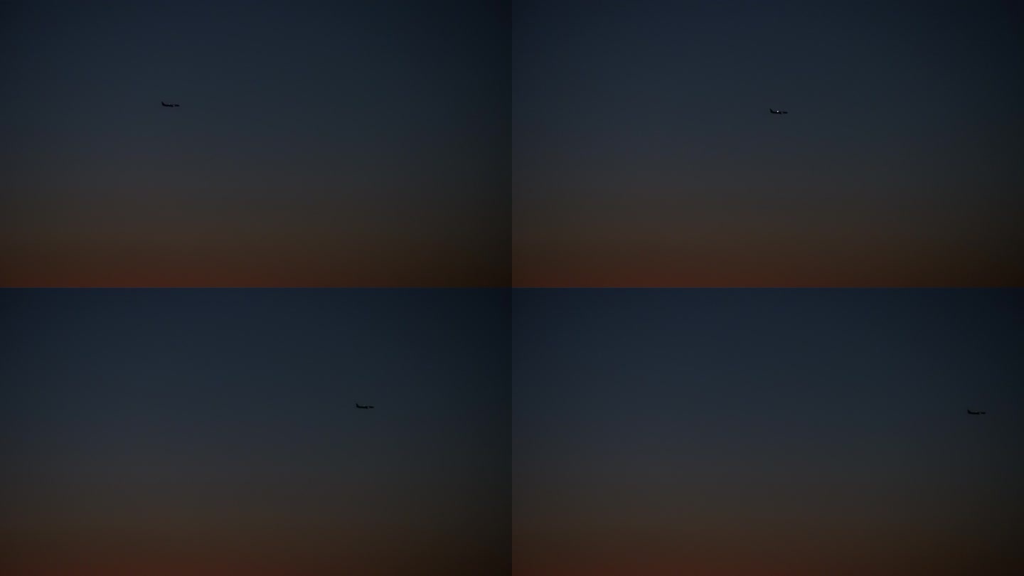 实拍傍晚夜空中平行滑翔的飞机