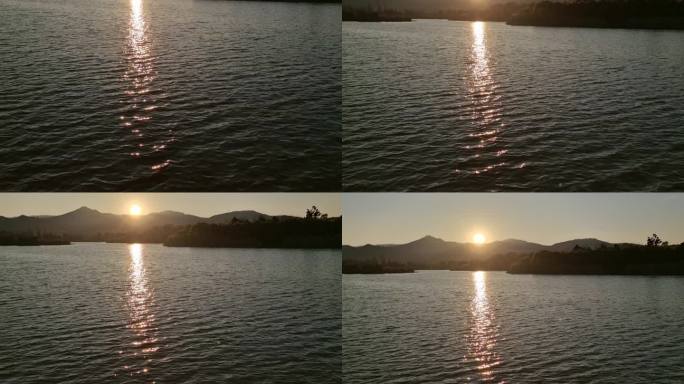 湖边落日余晖水面闪动光影