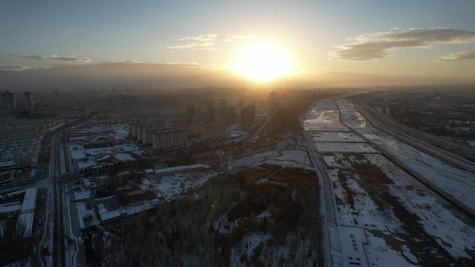 酒泉城市航拍日落冬季冬天雪后建筑