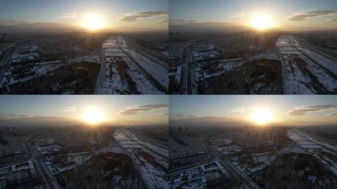酒泉城市航拍日落冬季冬天雪后建筑