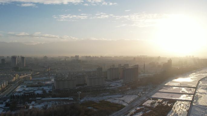 酒泉城市航拍日落冬季冬天雪后建筑