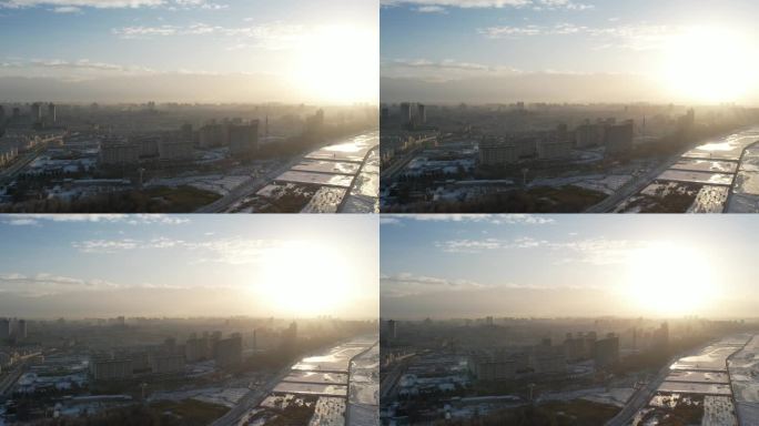 酒泉城市航拍日落冬季冬天雪后建筑