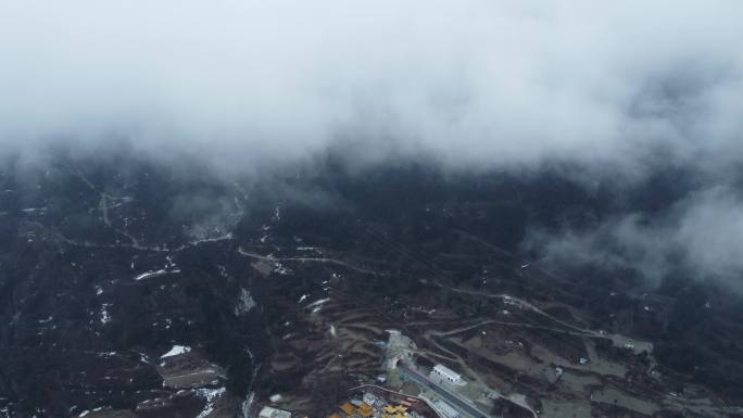 航拍雪后的康定城区跑马山南无寺