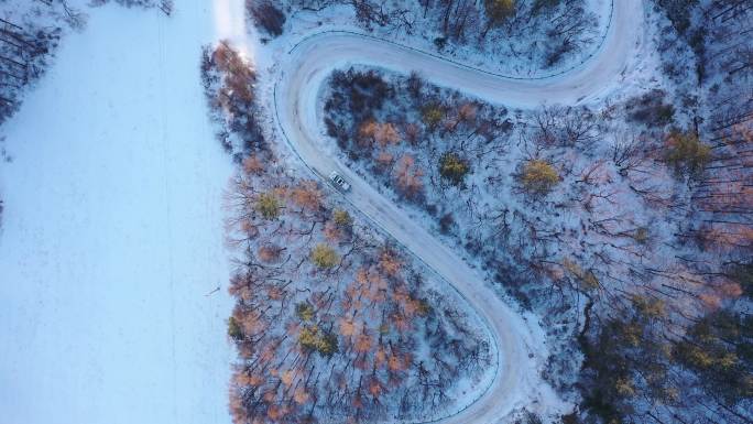 航拍4K冬季公安警车雪山公路行驶