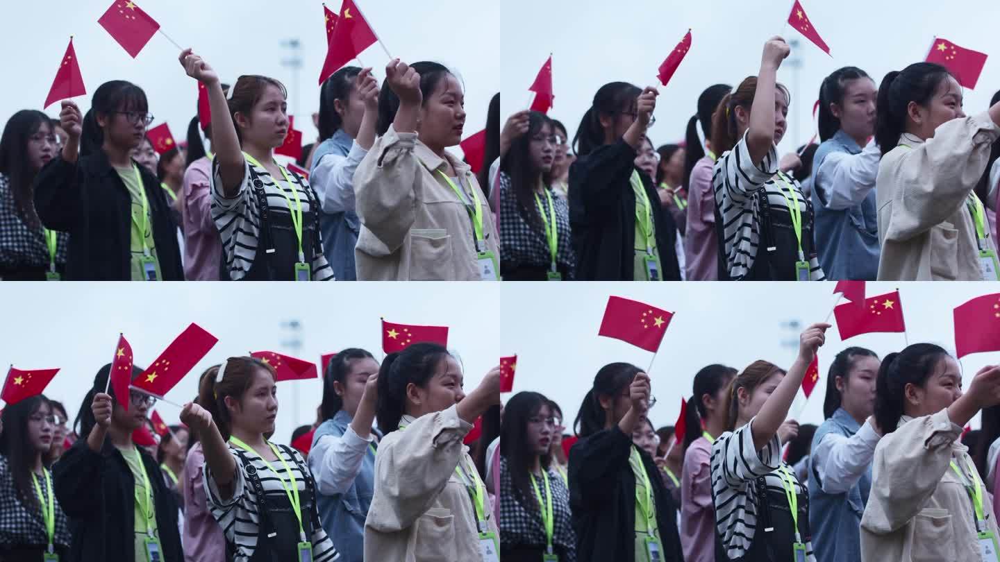 大学生挥动小红旗参加活动
