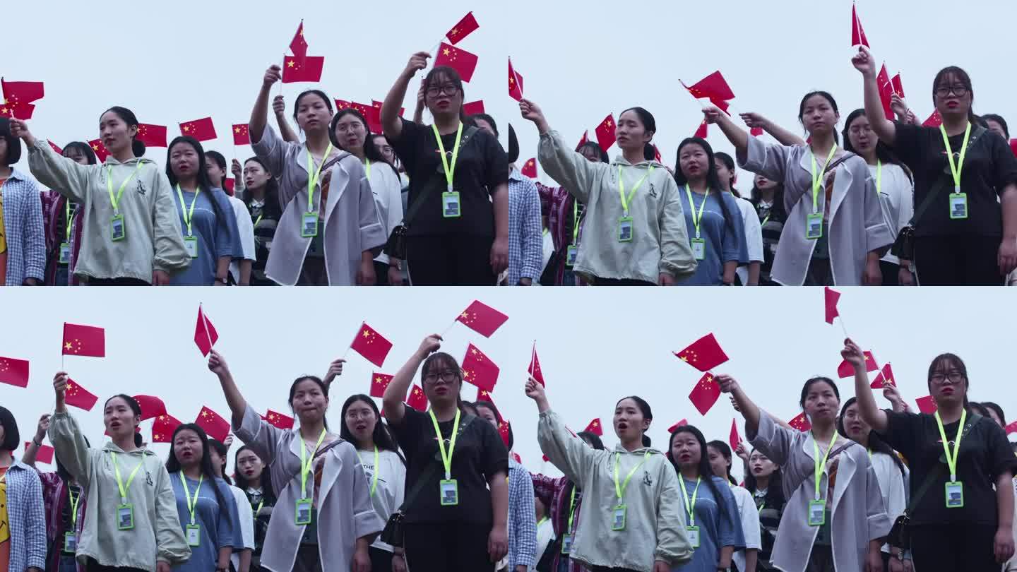 大学活动志愿者挥动小红旗