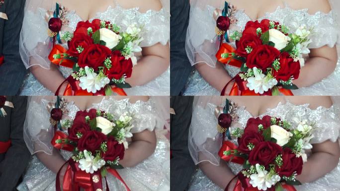 新娘手里的红色玫瑰花手捧花