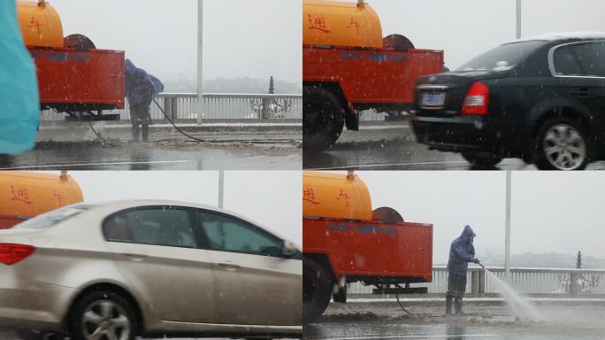 桥面路面清理积雪的工人洒水车