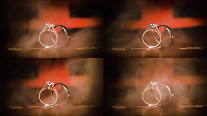 婚戒光影爱情信物对戒戒指烟雾特写