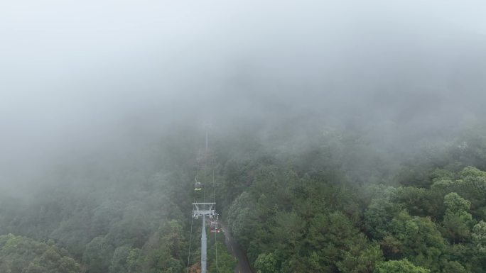 雨后雾天森林缆车航拍山林观光索道