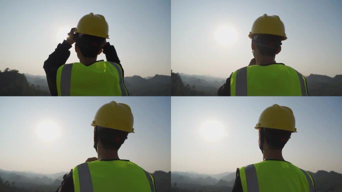 地质勘探工人山顶眺望背影中国基建高速勘测