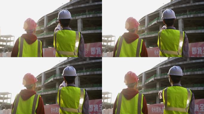 领导工地指导视察施工现场戴着安全帽在工地