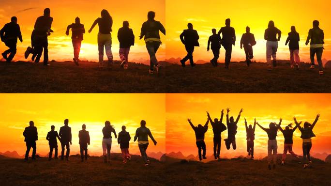 意气风发的一群青年人日落时在山顶奔跑跳跃