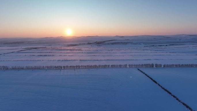 呼伦贝尔冬季田野雪景夕阳航拍