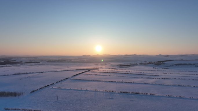 航拍呼伦贝尔冬季雪原夕阳