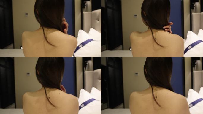 人像身体：美女的后背与正在整理的头发